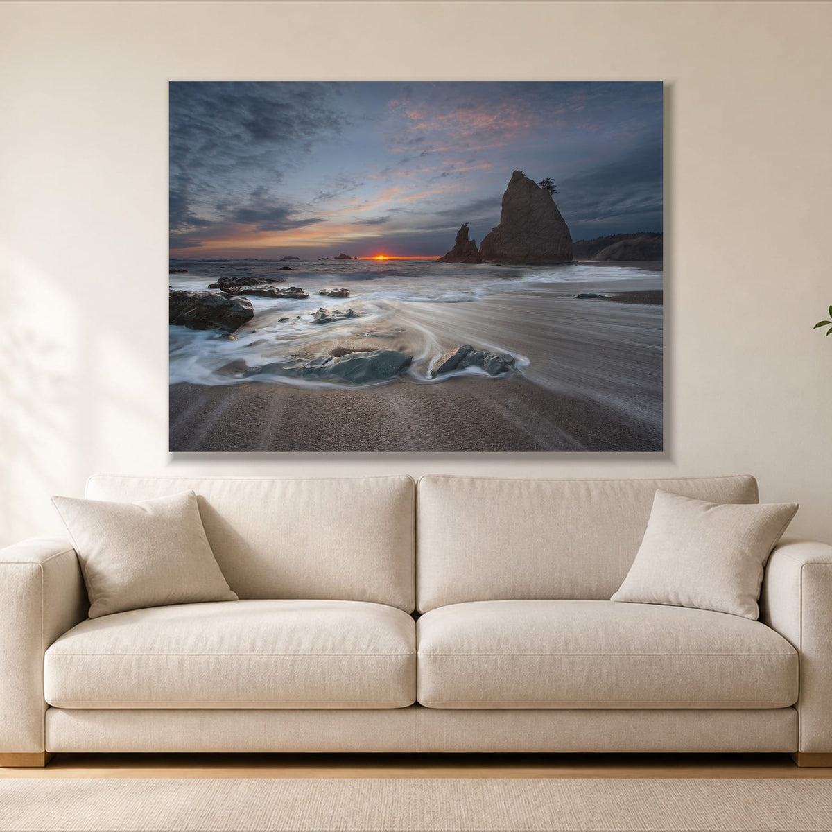 Sunrise on a Rocky Beach single panel canvas, gallery wrap, hung above a sofa